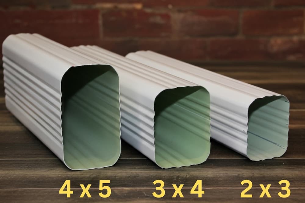 Different downspout sizes showing proper sizing for various gutter systems