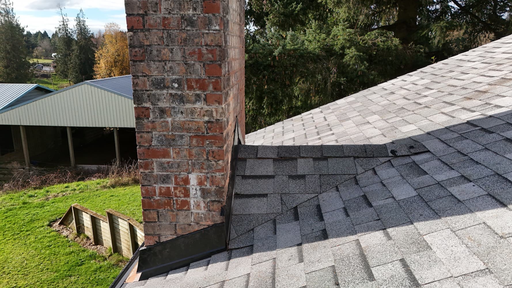 Chimney flashing detail after new roof installation