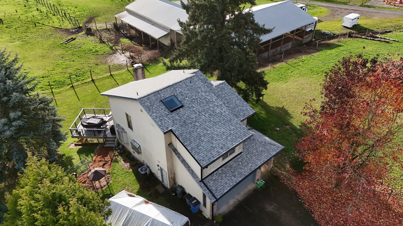 Grey asphalt shingles with black gutter system