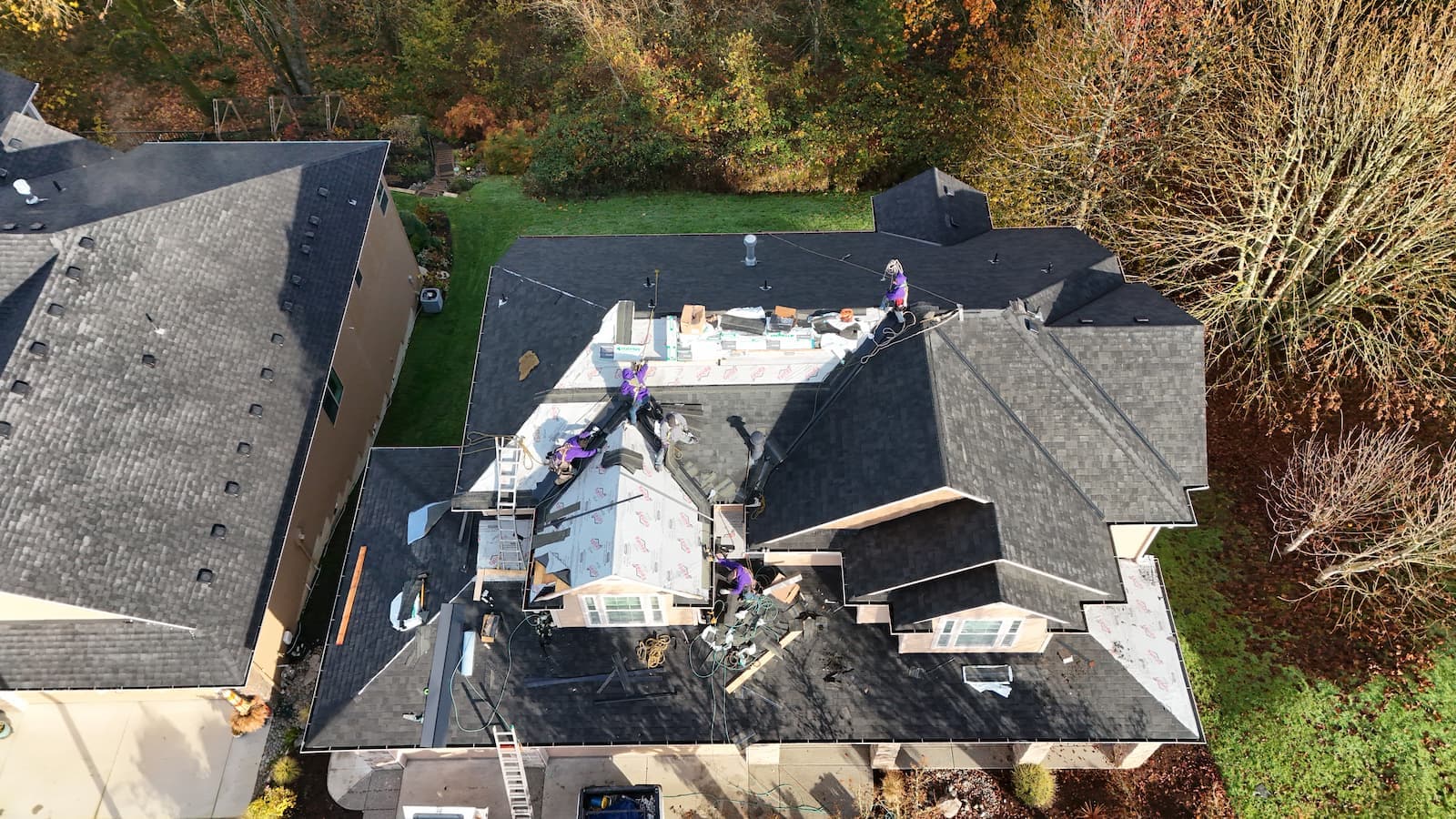 Aerial view of residential roof replacement with Malarkey architectural shingles