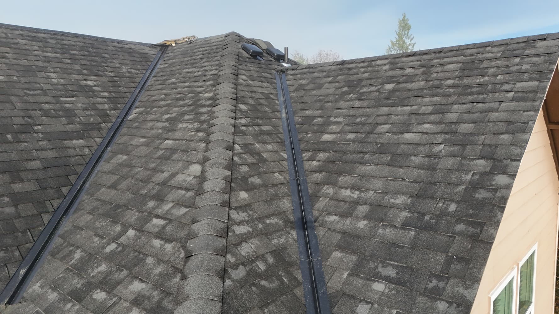 Ridge caps and metal valley flashing on Malarkey roof