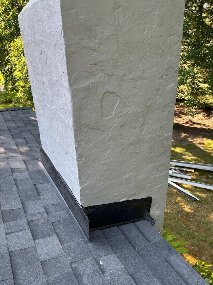 Chimney flashing installation by professional roofer