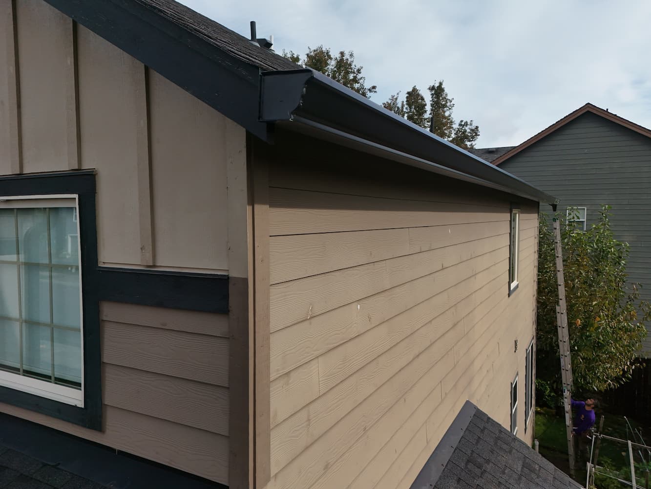New seamless 6-inch gutter installation on a Pacific Northwest home