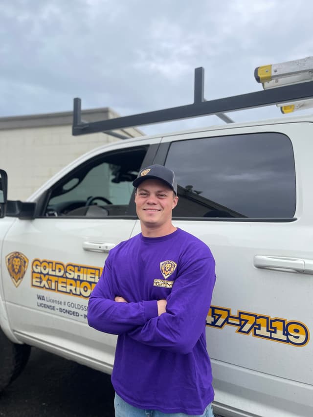 Gold Shield Roofing And Gutters professional roofer ready for emergency roof repair service
