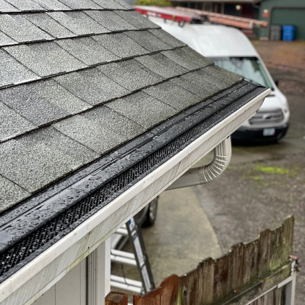 Professional micro-mesh gutter guard installation on residential home