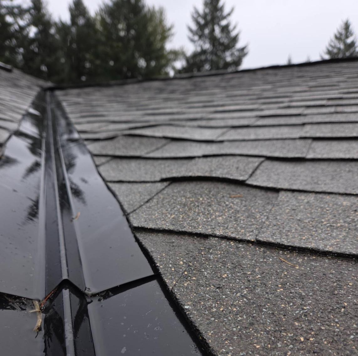 Aging roof showing lifting shingles near valley indicating when to replace roof