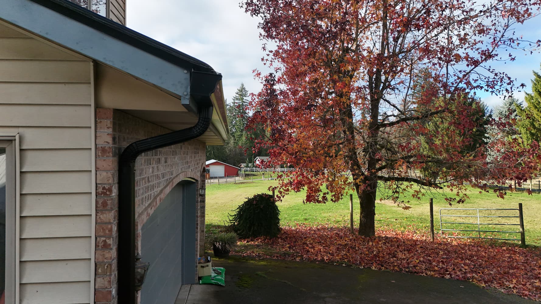 Close-up view of black gutter replacement installation