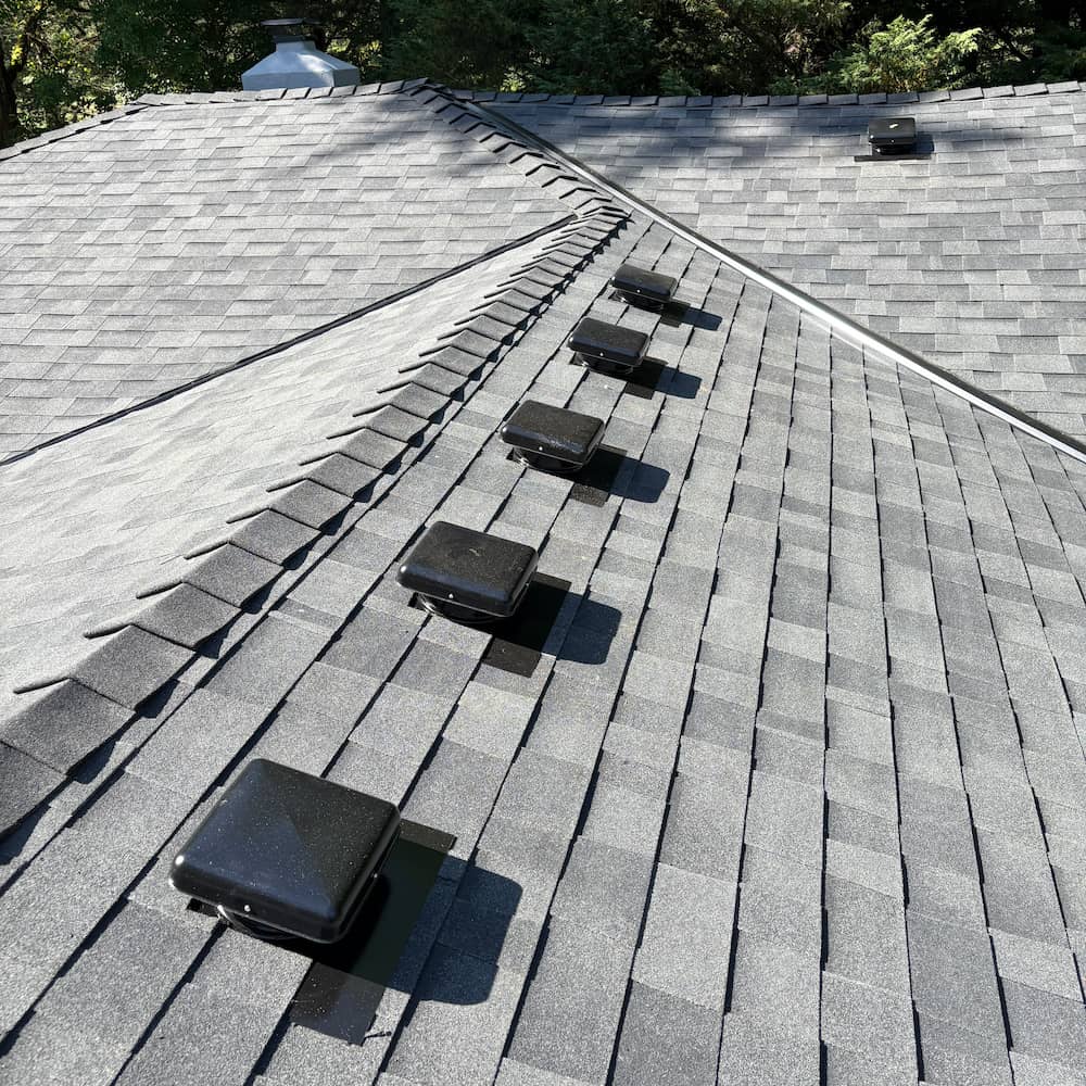 Light colored shingle roof installation by Gold Shield Exteriors